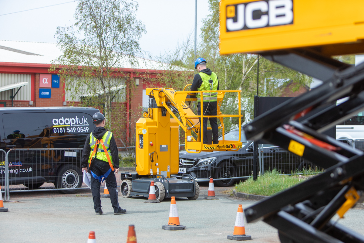 Boom lift in use in the training yard